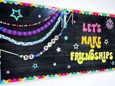 a sign that says let's make friends on the side of a blackboard