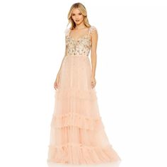 One Of Our Favorite Designs This Season, This Breathtaking Dress Has Us Completely Smitten. An Ornate Twist On Boho Styling, The Luxurious Gown Is Designed With A Fitted Jeweled Bodice That Spills Onto A Dreamy Skirt Of Weightless Tulle. Beaded Straps Alongside Fluttery Cap Sleeves And A Low, Sheer Back Are Details You’ll Swoon For. Color: Apricot Mac Duggal Tulle Fabric (100% Polyester) Partially Lined Bodice; Fully Lined Through Ruffled Skirt Sweetheart Neckline Beaded Ruffle Cap Sleeves Hand- Mac Duggal Prom, Mac Duggal Dress, Formal Dresses With Sleeves, Prom Long, Mac Duggal Dresses, Beaded Bodice, Tulle Gown, Mac Duggal, Chiffon Ruffle