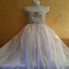 This "Illusion Rhinestone Look" Sequin & Taffeta Ballgown Set Is Available By Custom Order In Your Choice Of Size And Color. Color Options Are Subject To Availability. Fabrics & Trim Style Will Vary/Differ Based Upon Availability. Please Allow 1 To 2 Weeks For Production Before This Item Ships. This Item Is A Final Sale. No Returns, Refunds, Exchanges Allowed. Absolutely No Exceptions Made. The Sample Gown Sets Are Available To Ship Within 4 Business Days, To Be Sold As Is. Pageant Ball Gown Wedding Dress In Organza, Organza Ball Gown Wedding Dress For Pageant, Crystal Embellished Ball Gown For Pageant, Pageant Ball Gown With Detachable Train And Fitted Bodice, Pageant Ball Gown Wedding Dress With Fitted Bodice, Wedding Pageant Dress With Fitted Bodice In Organza, Fitted Organza Pageant Dress For Wedding, Organza Pageant Dress With Fitted Bodice For Wedding, White Organza Ball Gown For Pageant