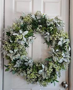 a wreath is hanging on the front door