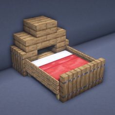 a bed made out of wooden pallets with a red blanket