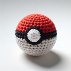 a crocheted ball with a pokeball on it