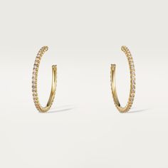 Cartier - Etincelle de Cartier earrings - Earrings Woman Gold/Diamond - Etincelle de Cartier hoop earrings, medium model, yellow gold (750/1000), each set with 37 brilliant-cut diamonds totaling 0.66 carats. Please note that the carat weight, number of stones and product dimensions will vary based on the size of the creation you order. For detailed information please contact us. Classic Yellow Gold Diamond Earrings For Evening, Luxury Cartier Diamond Earrings, Luxury Yellow Gold Earrings With Halo Design, Fine Jewelry Hoop Earrings With Pave Setting, Cartier Yellow Gold Jewelry With Prong Setting, Cartier Yellow Gold Formal Earrings, Elegant Cartier Diamond Earrings, Luxury Cartier Yellow Gold Earrings, Cartier Yellow Gold Jewelry For Evening