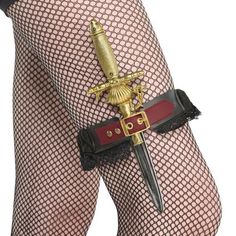 Keep your dagger concealed from the other pirates with this lace garter. It features a faux leather burgundy belt and a non-functioning antique gold buckle that hides the elastic loop that holds the sword in place.Black & Burgundy Pirate Maiden Lace Garter with Sword Prop product details:Garter 2in wide x 6.5in long when flatSword 10in longPolyester exclusive of decorationSpot clean only Pirate Core, Pirate Wedding, Pirate Costumes, Ateez Concert, Pirate Cosplay, Fantasy Party, Pirate Accessories, Character Clothes, Pirate Outfit