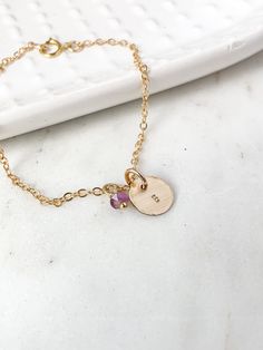 This personalized gold charm initial birthstone bracelet features a custom hand stamped gold charm. Makes a beautiful kids initial monogram bracelet for mom as well as a custom dainty gold layering bracelet bridal party gift for your bridesmaids, best friend gift or birthday gift for any lady in your life or treat yourself to a little sparkle. ♥︎  Made of 14k gold chain with a spring ring clasp and a 14k gold filled 13mm round disc charm. The charm can be personalized with any initial of your ch Bracelet For Mom, 3 Letter Monogram, Monogram Bracelet, Bracelet Initial, 3 Letter, Letter Monogram, Heart Symbol, Initial Monogram, Birthstone Bracelet