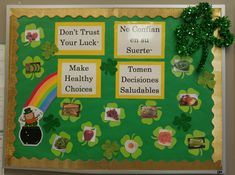 a bulletin board with shamrocks and pictures for st patrick's day on it