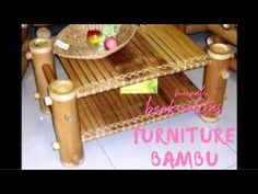 a table made out of bamboo sticks with a bowl on it and the words furniture samsu written in pink