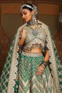 Emerald green toned attached cancan kalidar lehenga with chevron striped gota, badla, dori embroidery and heavy tassel ornamentations. Paired with a half sleeves flattering V neckline padded blouse with blossom dori jaal embroidery, dangling glass beads hem detail and heavy embellished scallop border net dupatta with gota checkered details. - Aza Fashions Elegant Green Lehenga With Meenakari, Elegant Green Meenakari Lehenga, Designer Green Lehenga With Meenakari, Designer Wear Green Lehenga With Meenakari, Kalidar Lehenga, Jaal Embroidery, Dori Embroidery, Scallop Border, Padded Blouse