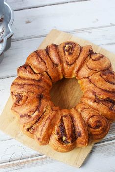 a bundt cake sitting on top of a wooden cutting board