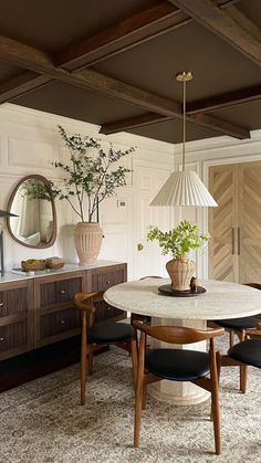 a dining room with a table and chairs