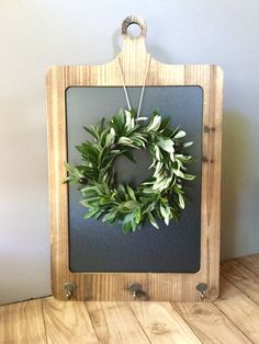 a wooden frame with a wreath hanging on it