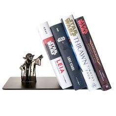 a star wars bookend with books on it