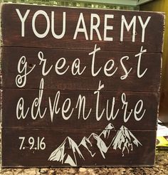 a wooden sign that says you are my greatest adventure