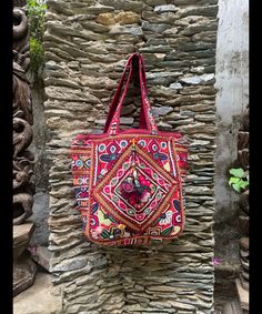 About bag  Indo-gypsy fusion, everyday use hand bag made from Banjara fabrics sourced from Vintage tribal costumes of regions of Rajastan and Gujarat. These are embellished with light catching coins, and intricate bead work tassels. Size - length 15 inches/ width 21 inches Company details:  Company name: Houseoftextile  Contact number: +919784447473  Email id: houseoftextile77@gmail.com  Shipping & custom : Delivery through one of the finest service providers : Skyway, Fedex, UPS  And DHL. Any l Traditional Rectangular Potli Bag For Travel, Rectangular Handwork Festival Bag, Red Handwork Bag For Everyday Use, Daily Use Festival Tote Bag, Festival Rectangular Bags With Multicolor Embroidery, Multicolor Bags With Traditional Patterns For Everyday Use, Bohemian Square Embroidered Bag, Rectangular Festival Bag For Daily Use, Red Embroidered Festival Bag