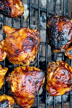 chicken wings are cooking on the grill