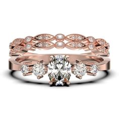 a rose gold wedding ring set with an oval cut diamond in the center and two round diamonds on each band