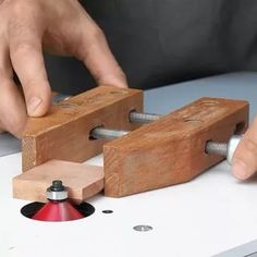 a person working with woodworking tools on a table