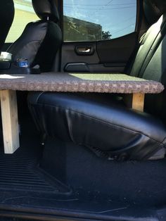 the back seat of a car with a table on it