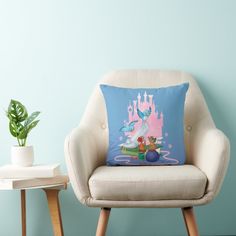 a white chair with a pillow on it next to a potted plant and a blue wall