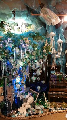 a room filled with lots of blue and green decorations