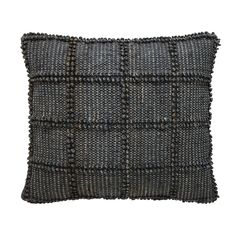 a gray and black pillow on a white background