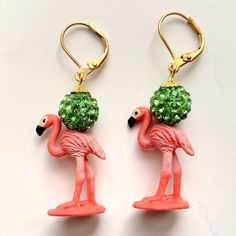 Cute miniature flamingo earrings with shimmering rhinestone pave beads. Lightweight earrings with miniature resin flamingo figurine to complete your resort style. Perfect flamingo gift for flamingo lovers. Dainty 1.75" drop with comfortable and secure lever backs that are gold-plated and nickel-free. Flamingo Earrings, Flamingo Gifts, Cute Miniature, Pave Beads, Lightweight Earrings, Resort Style, Light Weight Earrings, Flamingo, Jewelry Earrings Dangle