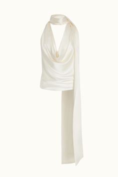 The shoulder-flattering cut and the elegant draping of a deep cowl neckline, this convertible top can be worn in a myriad of ways. Made from sultry silk, it’s the long, oversized bow that drapes your back and brings the drama. Orseund Iris offers a 14-day exchange & return policy for all items except for final sale pieces. Orseund Iris, Neck Halter Top, Ballerina Skirt, Fancy Fits, Draped Top, Convertible Top, High Neck Top, Halter Tops, Halter Neck Top