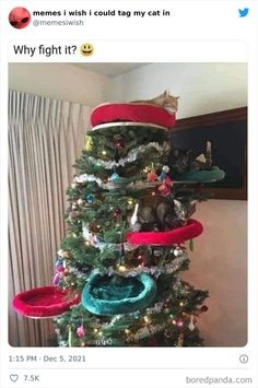 a christmas tree with cat toys on top