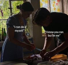 two women are preparing food in the kitchen together and one woman is holding a knife