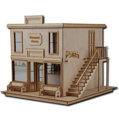 a wooden model of a store with stairs leading up to the second floor and windows