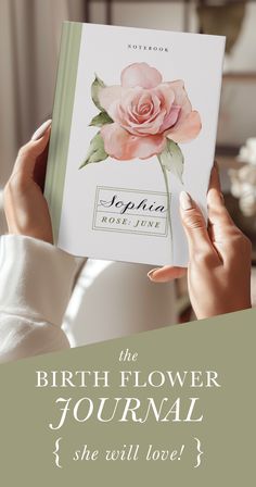 the birth flower journal is being held up in front of a woman's face