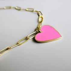 The Gold-Filled Enamel Heart Necklace features an enamel heart pendant on a gold-filled Paperclip Chain. The most fun statement! Available in your choice of White, Baby Pink or Sky Blue. Materials: 18k Brazilian Gold-Filled Chain & Findings Pendant Measurements: 29mm x 24mm Drop Length: 2” inches Chain Length: 16” + 2” Chain Extender Pink Enamel Necklace For Valentine's Day, Heart-shaped Enamel Charms Necklaces, Heart-shaped Enamel Charms Necklace, Enamel Heart Charms Necklace, Enamel Heart Charm Necklace For Valentine's Day, Gold Enamel Heart Necklace For Valentine's Day, Valentine's Day Gold Enamel Heart Necklace, Gold Heart-shaped Enamel Necklace, Heart-shaped Gold Enamel Necklace