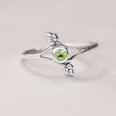 Dainty, unique, sparkly, you'll love this tiny beauty! Emulating the eye of protection, framed with leaves, featuring a sparkly Peridot gemstone. August's birthstone, peridot is believed to instill power & influence in the wearer. And yes, you are allowed to wear peridot even if not your birthstone! Natural Peridot Safe to wash your hands with them on! Solid .925 sterling silver Eye Of Protection, August Birthstone Ring, Vine Ring, Birthstone Rings, August Birthstone, Vine Design, Peridot Gemstone, Argentium Silver, Wash Your Hands