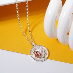 This pendant offers a keepsake that caters to several special occasions! A photo and initials you want on the front plus a space on the reverse side for a personalized text engraving! With your choice of length on a 16", 18" and 20" Perfect for newlywed photos, children, any couple, and family. The back can be engraved with a personalized message. The photo is scratch and water-resistant and comes with a lifetime warranty. NECKLACE INFORMATION SKU: JNCY103629 Metal type and color: Sterling Silve Personalized Medallion Charm Necklaces, Valentine's Day Anniversary Round Pendant Locket Necklace, Father's Day Engraved Keepsake Jewelry, Father's Day Keepsake Engraved Jewelry, Medallion Necklace For Anniversary Gift On Valentine's Day, Mother's Day White Gold Locket Necklace, Medallion Necklace For Anniversary And Valentine's Day, Customizable Silver Locket Necklace For Anniversary, Anniversary Locket Charm Necklace With Round Pendant