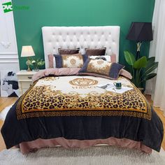 a bedroom with green walls and a leopard print bed spread on the bed, next to a white headboard