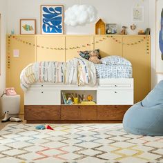 a child's bedroom with a bed, dresser and toy chest in the corner