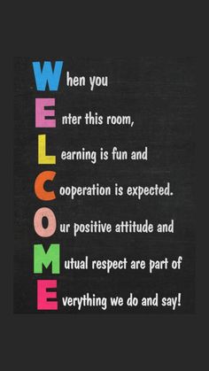 a chalkboard with the words welcome written in multicolored letters on black paper