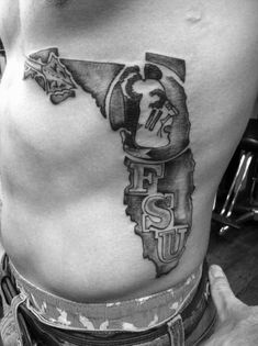 a man with a tattoo on his stomach that reads florida and has a skull in the shape of a map