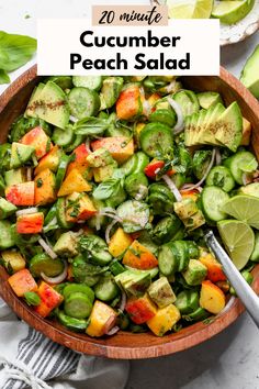 a wooden bowl filled with cucumber peach salad