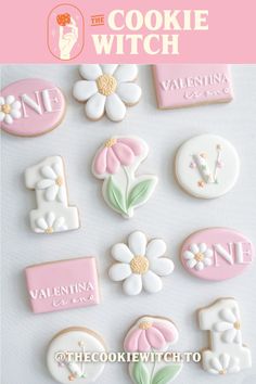 the cookie witch cookies are decorated with pink and white icing