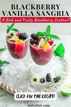 blackberry vanilla sangria with fruit in glasses on a platter and lime wedges