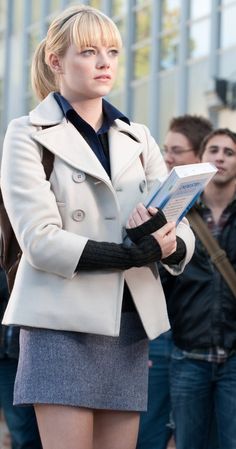 a woman standing in front of a group of people