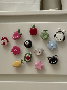 there are many different magnets on the fridge