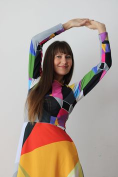 CITRINE DRESS  The original abstract print design on the dress is created by a professional artist. Colourful abstract print dress with geometrical elements, with long sleeves. Be unique. Be outstanding. Be authentic. Bright and lively colors have the power to uplift mood and instill a sense of joy. Wearing a vibrant color dress can evoke feelings of happiness and positivity, brightening not only the wearer's day but also those around her. The dress showcases an original abstract print design, where dynamic geometrical elements dance across the fabric in a symphony of colors. Bold triangles, squares, and circles intertwine, creating a visual feast for the eyes. Each element is meticulously placed to evoke a sense of movement and rhythm.  * 95% polyester, 5% elastane (fabric composition may Multicolor Abstract Print Party Dress, Party Dresses In Multicolor Abstract Print, Party Dress With Multicolor Abstract Print, Multicolor Long Sleeve Dress With Geometric Pattern, Vibrant Multicolor Abstract Print Dress, Long Sleeve Multicolor Dress With Geometric Pattern, Multicolor Abstract Print Midi Dress, Multicolor Abstract Print Maxi Dress For Party, Multicolor Graphic Print Dress For Party