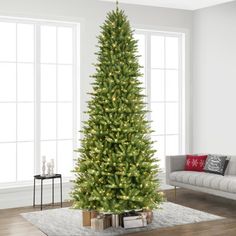 a living room with a christmas tree in the corner