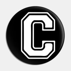 a black and white button with the letter c