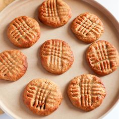 six cookies are arranged on a plate with one cookie in the middle and four out