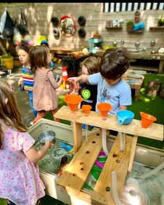 children playing with toys in an outdoor play area