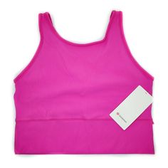 Lululemon Pivot Tank Top *Rib Color: Sonic Pink  SNCP This tank is designed for: Training Wear this cropped tank as a V-neck or turn it around for more coverage in the front. Features: Ribbed fabric is sweat wicking and quick drying. Fabric is smooth next to the skin. Added Lycra for stretch and shape retention. Tight fit, cropped length. Size 14 = 17.5  Inches from arm pit to arm pit FREE Shipping in the USA! 60 day returns, item must be returned in original condition (with tags attached, if ap Lululemon Pink Activewear For Pilates, Lululemon Athleisure Sports Bra With Built-in Bra, Lululemon Sports Activewear With Built-in Bra, Lululemon Athleisure Activewear With Built-in Bra, Lululemon Activewear With Built-in Bra For Light Exercise, Lululemon Sporty Activewear With Built-in Bra, Functional Lululemon Tank Top For Training, Functional Training Tank Top By Lululemon, Sports Tank Crop Top With Built-in Bra