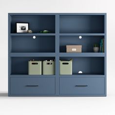 a blue bookcase filled with books and boxes